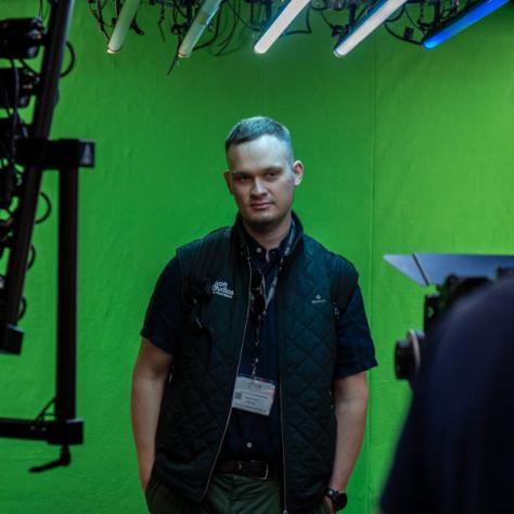 Man in front of green screen. 