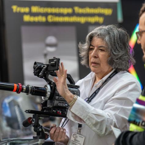 Woman behind a camera. 