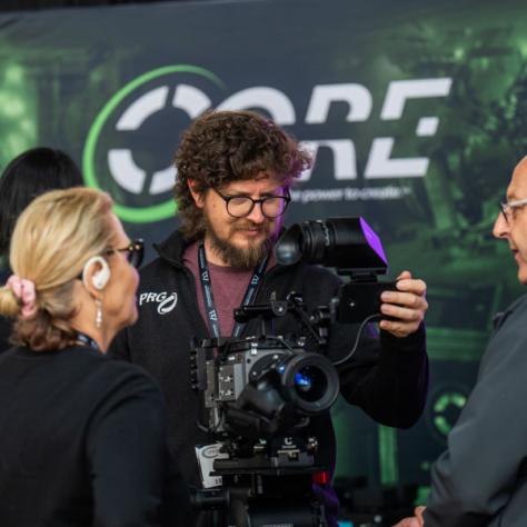 People working with a camera. 
