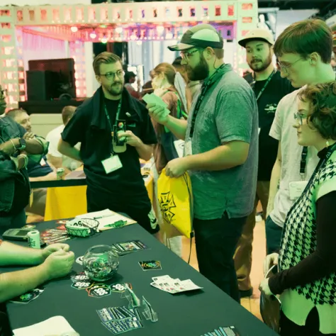 People standing around a table. 