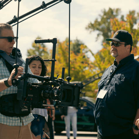 Man working with a big camera. 