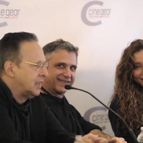 Panel members talking. 