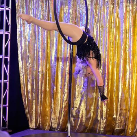 Person on stage performing. 