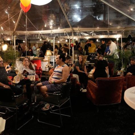 Photo of people sitting at party. 