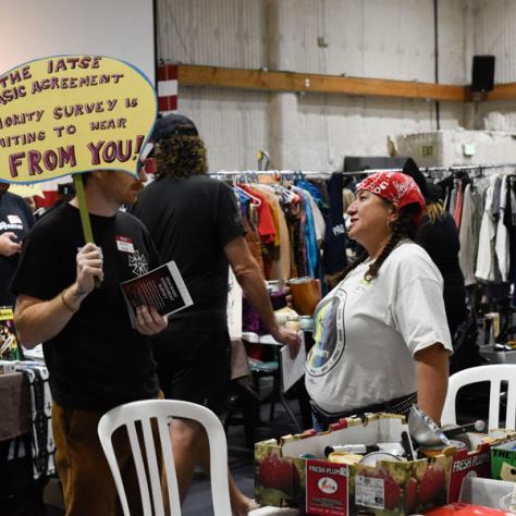 People talking at yard sale.