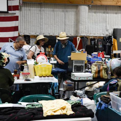 People shopping at yard sale.
