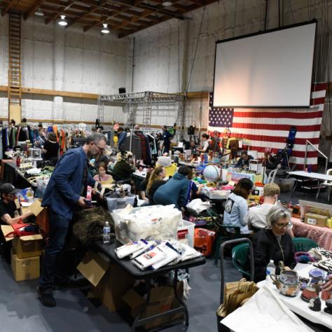 People shopping at yard sale.