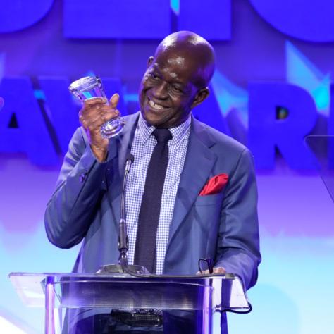 Baz Bamigboye, Deadline International, accepts the International Media Award (Photo by: Evans Vestal Ward/ICG)