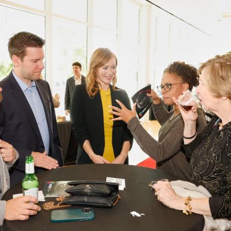 People talking around a table. 