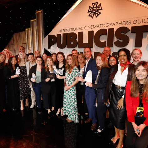 Group photo of people under 'Publicists' sign. 