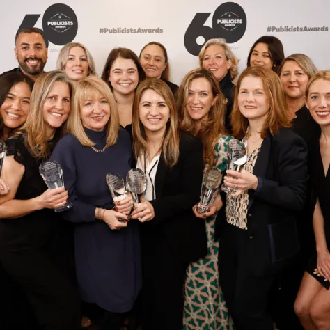 Group photo of people with awards. 