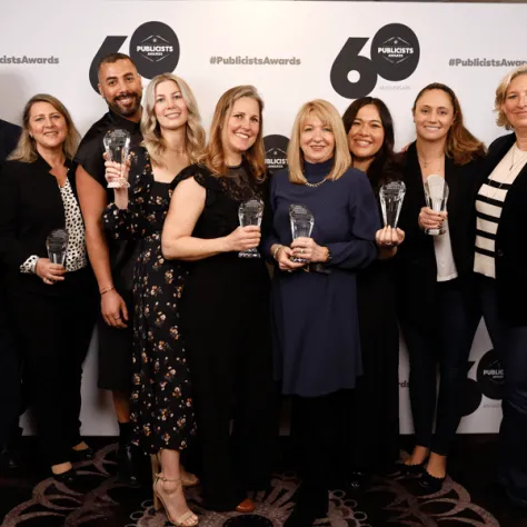 Group photo of people with awards. 