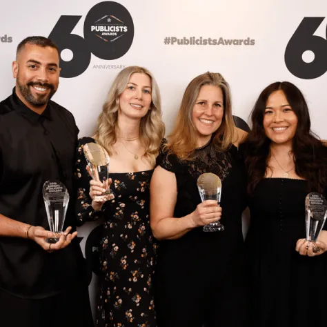 Group photo of people with awards. 