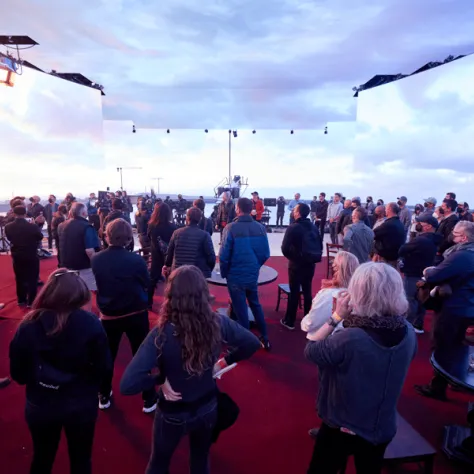 Crowd in room with clouds. 