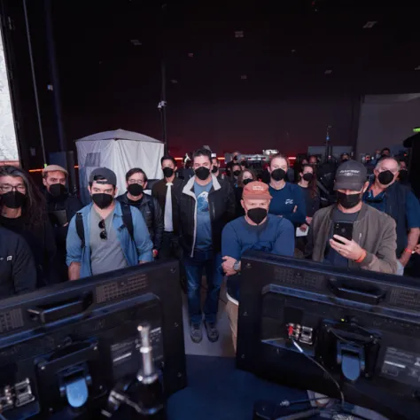 Group of people looking at screens. 