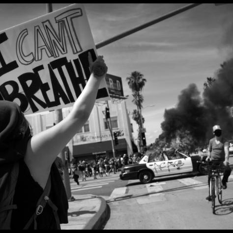 Person holding a "I Can't Breathe" sign. 