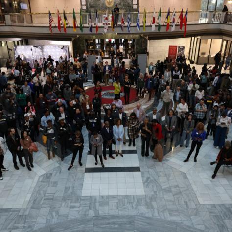 Arial view of people at event posing for a photo. 