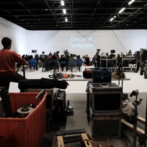 View of equipment and people standing in the background. 