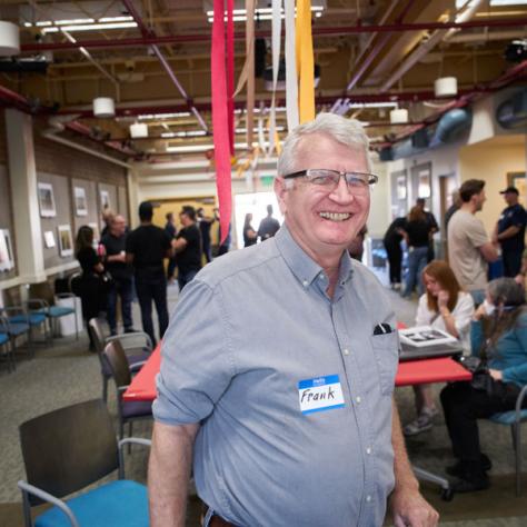 Man posing for photo together at party.