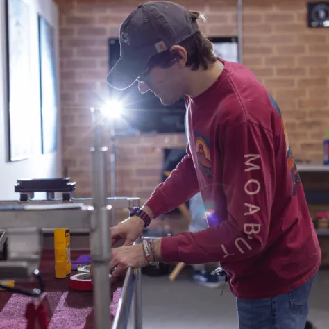 Man working on a table. 