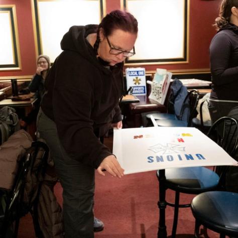 Woman making a sign