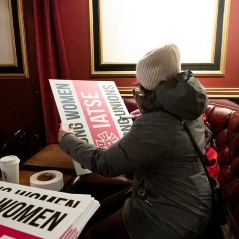 Woman inspecting a sign
