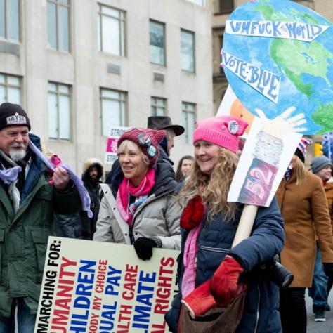 Women holding signs and marching