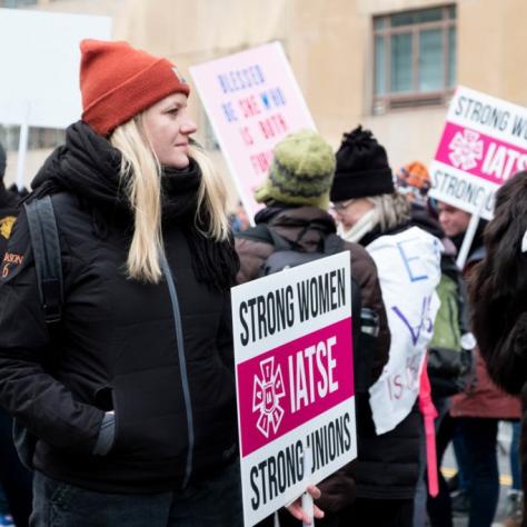 People holding signs