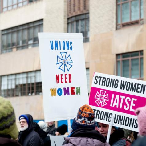 People holding signs