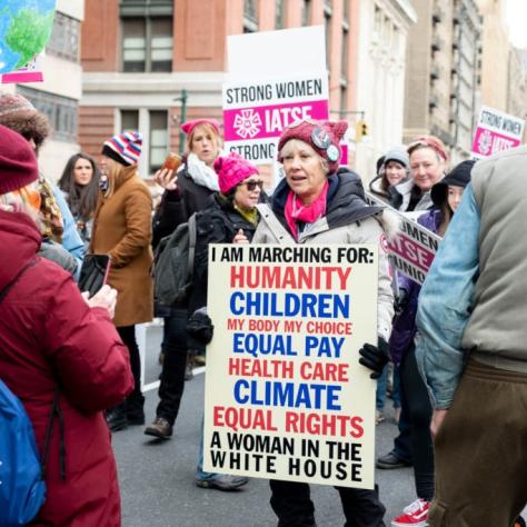 People holding signs and marching
