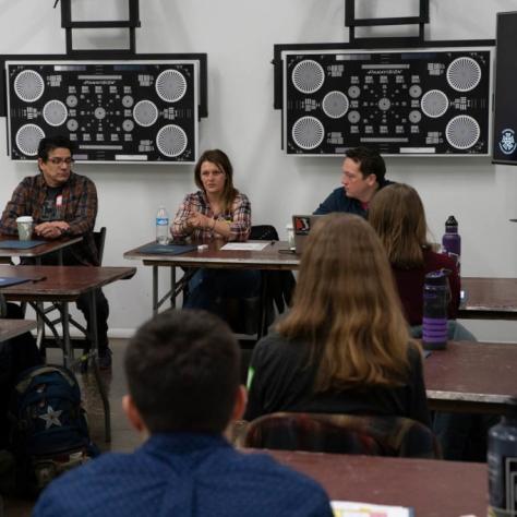 Woman speaks in front of students