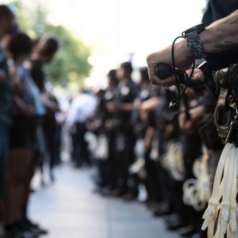 Protester face police in a line