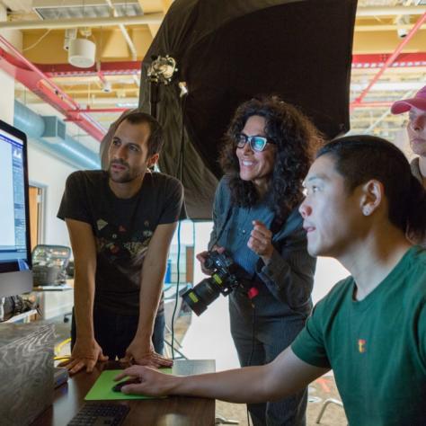 People look at an image on a screen