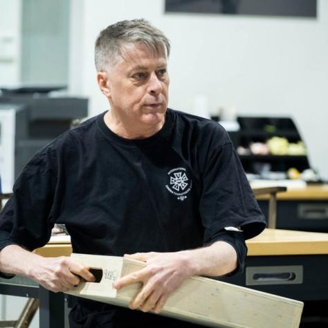 Man sits with box