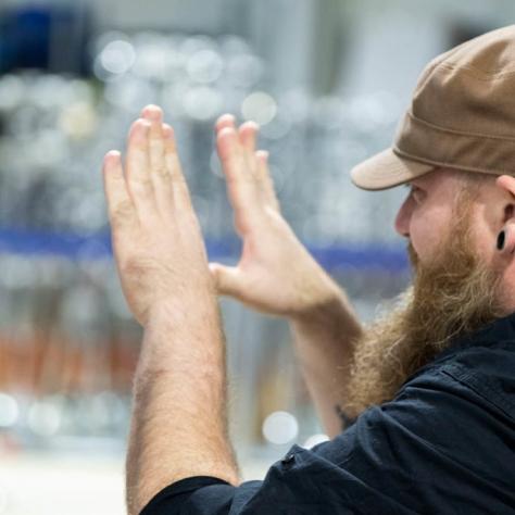 Man looks through his hands